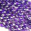 Natural Purple Amethyst Smooth Polished Oval Tumble Beads Strand Length is 14 Inches & Sizes from 9mm to 10mm approx.Pronounced AM-eth-ist, this lovely stone comes in two color variations of Purple and Pink. This gemstones belongs to quartz family. All strands are hand picked. 